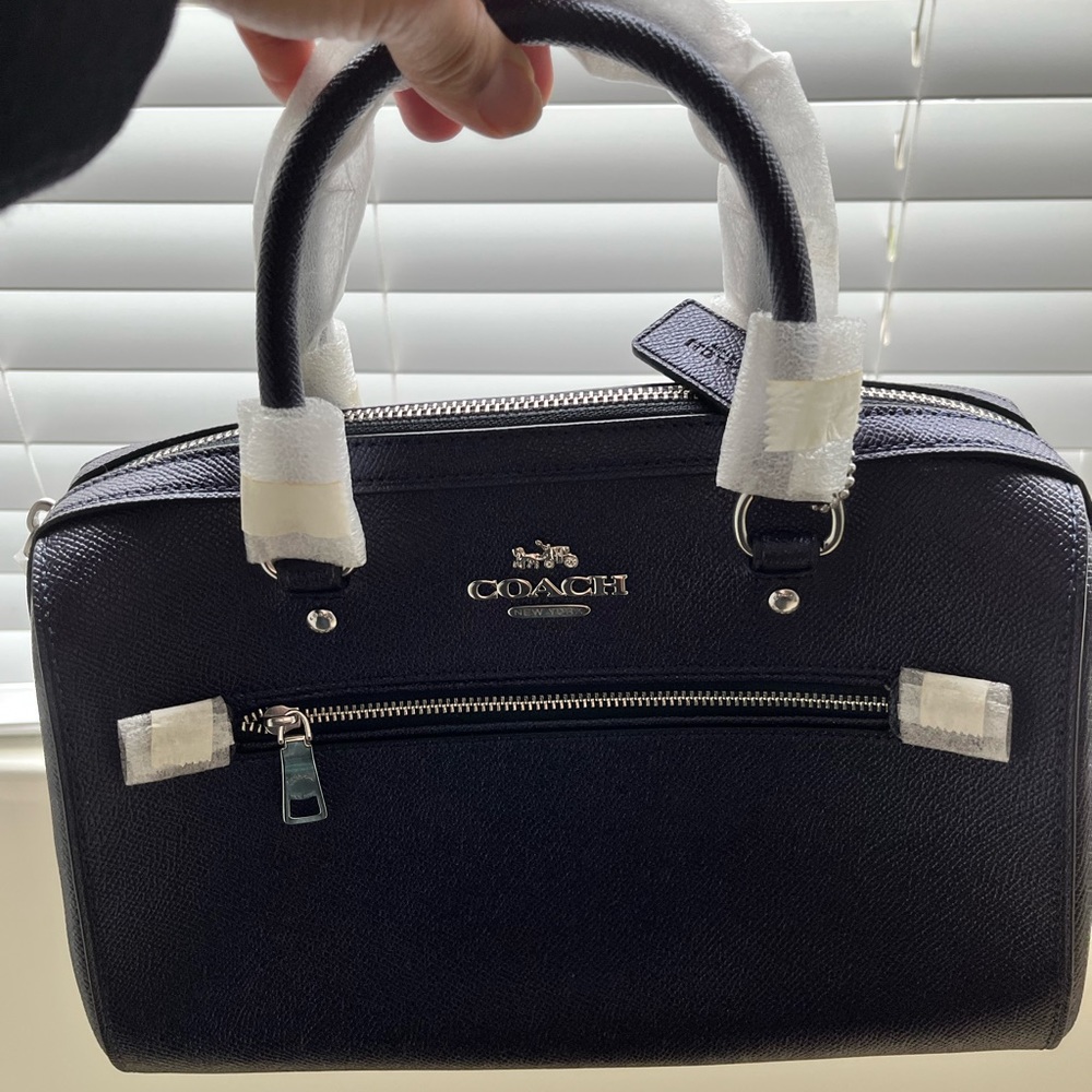 Its a purple coach handbag.